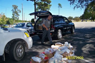 Officers helping load the food
