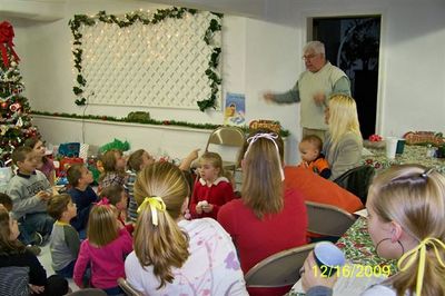 Pastor Larry leads the children in song
