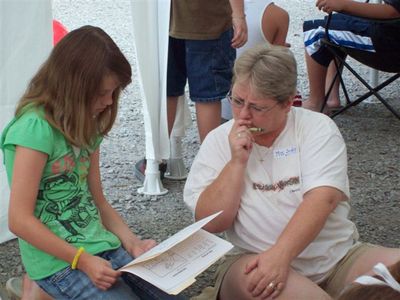 Judy helps this girl on a puzzle
