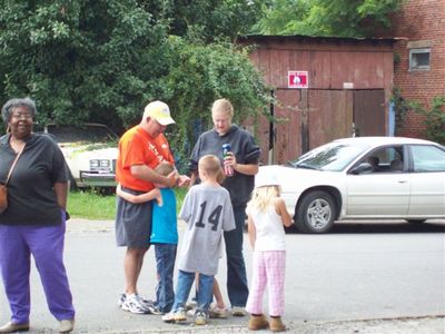 Pastor Larry talks w/a family
