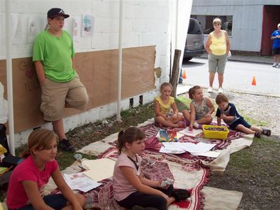 Eric & the kids watch the puppet show
