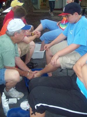 Robert washes Eric's feet
